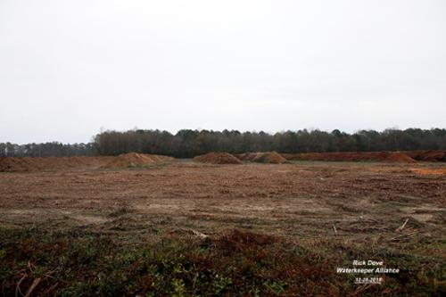 The few state regulations that exist require piles of poultry litter (feces) placed in the field to be covered if left exposed to the elements for more than 14 days.  If left uncovered, rain water can percolate through the pile. Its polluting leach-ate can then be discharged to local waterways. 
